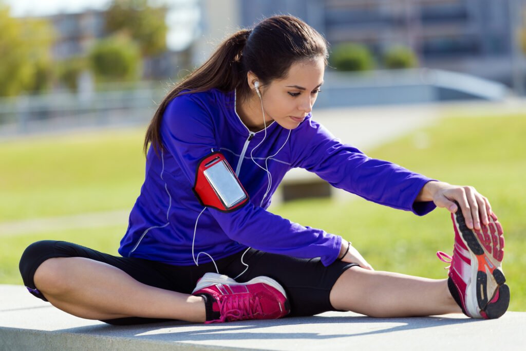 Runner stretching and preparing to work on running form