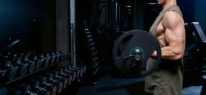 Close-up of barbell and weight plates at IN Fitness Club